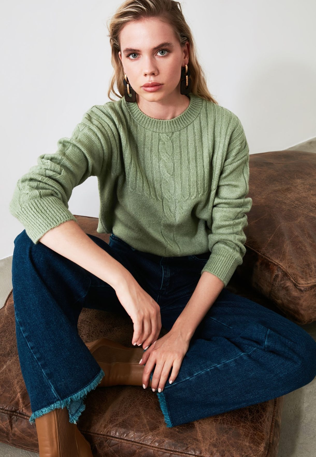 green cable knit sweater